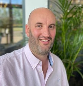 A headshot of Jon Jonson, the Director of Mountain Perspective smiling