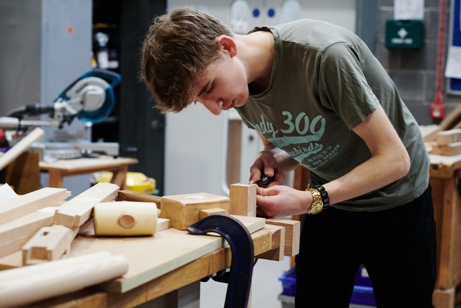 student working on their project in carpentry class