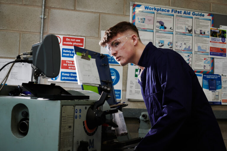 student working on a machine in the engineering workshop HNC/HND Electrical Electronic Engineering