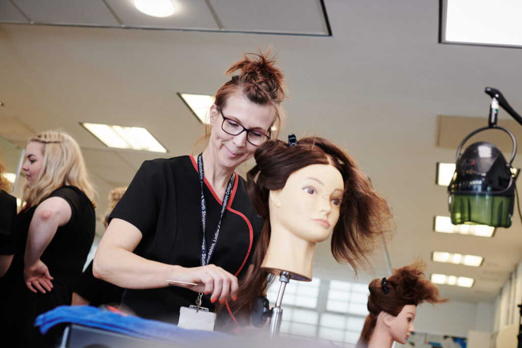 student working on a models hair at Herefords hair and beauty studio