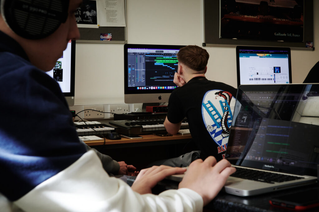 students in the music studio making music on computers