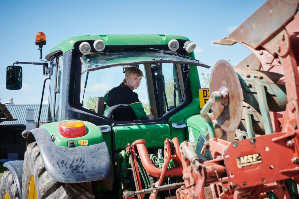 Student in a tractor