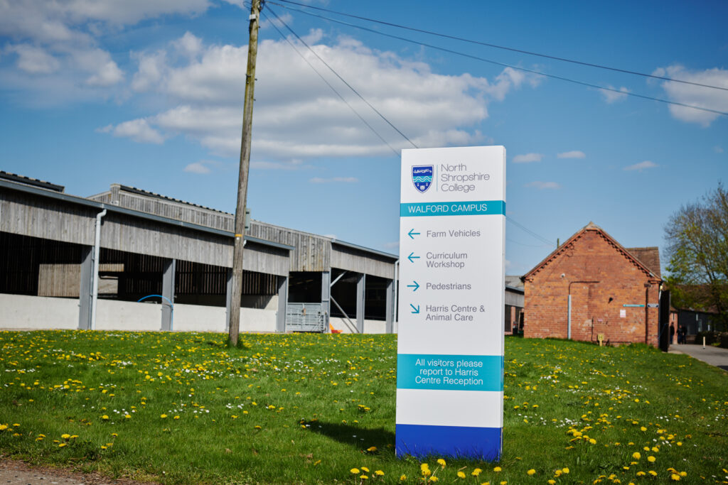 picture of the Walford campus direction signs pointing towards the different services and directions to the college like farm vehicles, workshops, pedestrians, and animal care