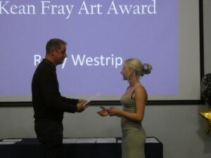 Ruby Westrip is handed her award by Oliver Smith