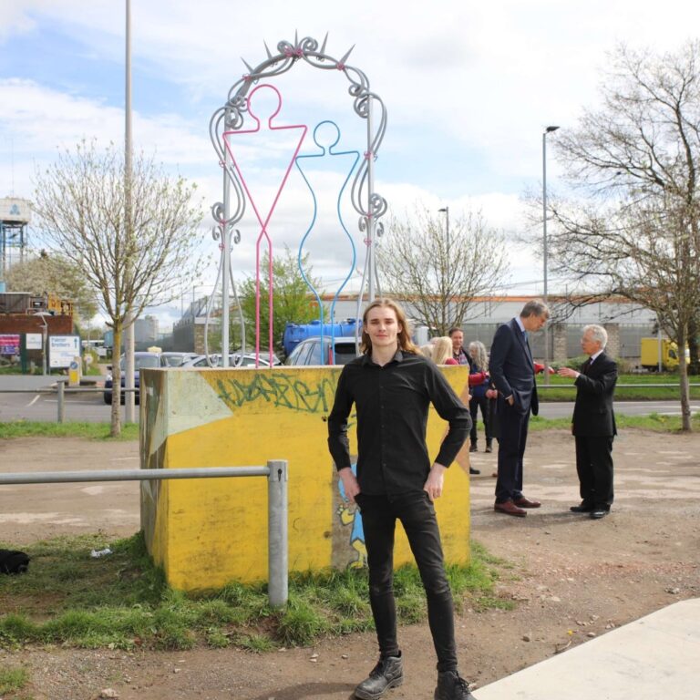 Daniel stands next to new sculpture 'Reflection' in Hereford Skate Park