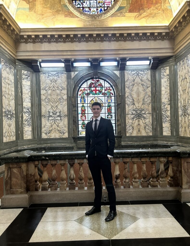 Charlie Webb, LSFC alumni poses in a religious looking building