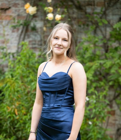 Student Kiera in blue dress.