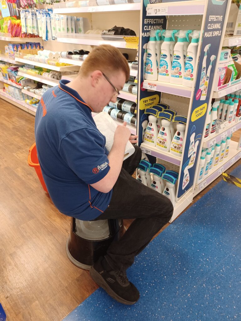 Callum developing retail skills during his Supported Internship at The Range.